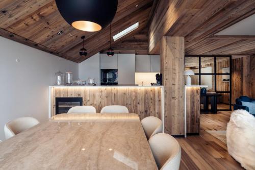 a dining room with a table and chairs at Antarès SIRIUS 301- Spacious ski inski out apartment in Méribel