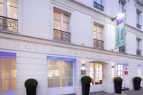 a hotel marguerite building with the hotel marguerite sign on it at Le Marceau Bastille in Paris