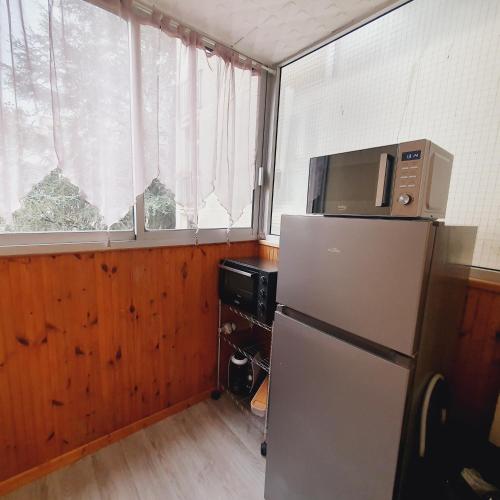 Una cocina o zona de cocina en Séjour cosy près de Paris T3 cuisine ouverte et bar