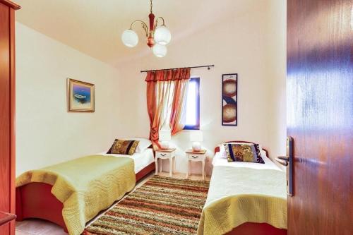 Postel nebo postele na pokoji v ubytování Apartments Lidija