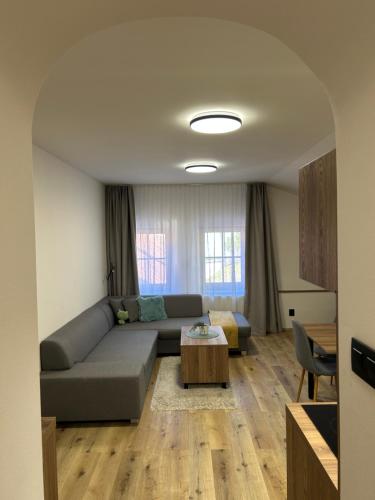 a living room with a couch and a table at Penzion Aurelia Donovaly in Donovaly
