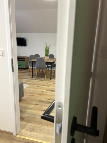 a room with a table and chairs and a dining room at Penzion Aurelia Donovaly in Donovaly