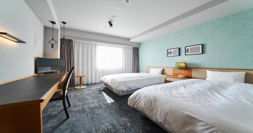 Katil atau katil-katil dalam bilik di Hotel Grand Ciel Hanamaki