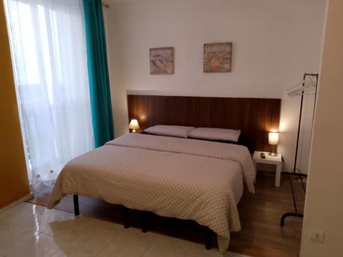 Posteľ alebo postele v izbe v ubytovaní L'Arco