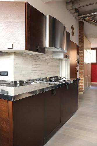 Kuchyň nebo kuchyňský kout v ubytování La Corte di Brusuglio Apartments