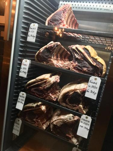 a display case in a store with different types of meat at The Porterhouse grill & rooms in Oxford