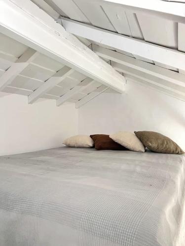 two pillows sitting on a bed in a room at Monte de Santa Rita in Évora Monte