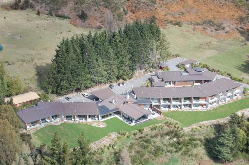 an aerial view of a large house with a yard at Braemar Lodge And Spa in Hanmer Springs
