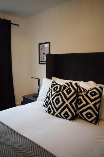 a bed with two pillows on top of it at The Little Luxury Getaway! in Moortown