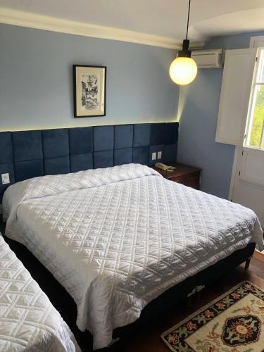 Postel nebo postele na pokoji v ubytování Hotel Pousada Minas Gerais