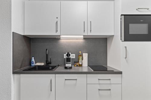 Kuchyň nebo kuchyňský kout v ubytování Ankerherz Appartements bei Blankenese