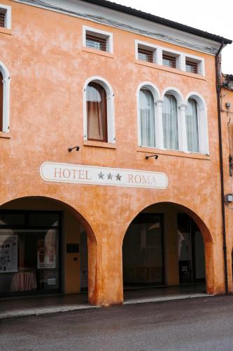 an orange building with a hotel roma sign on it at Hotel Roma in Cittadella