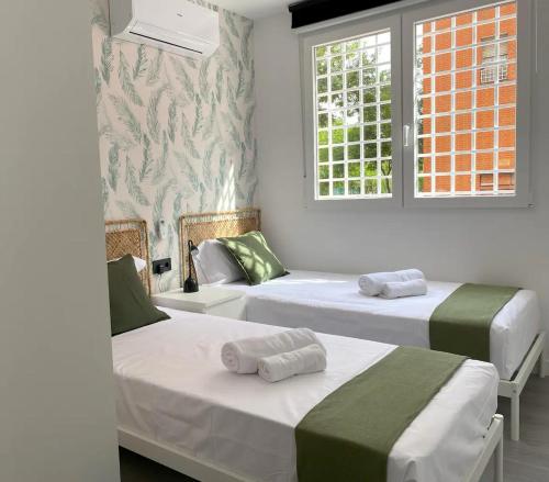 En eller flere senge i et værelse på Comodo apartamento familiar en Madrid VT-14903