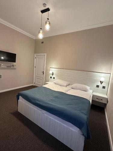 Katil atau katil-katil dalam bilik di Central Baku Hotel
