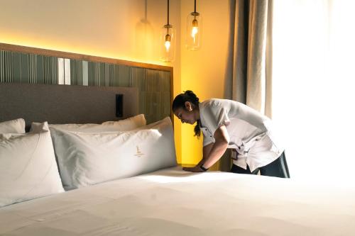 Katil atau katil-katil dalam bilik di Legado Magdalena Hotel