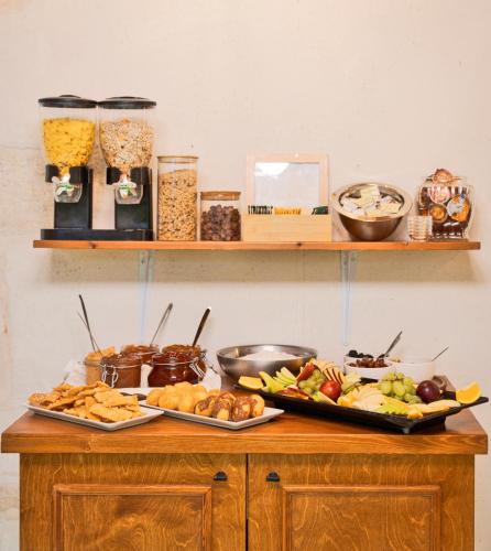 a table with two trays of food on it at Mansio Boutique Hotel in Rethymno Town