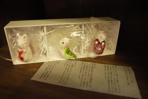 three toy figurines in a plastic box on a table at Takamatsu Tokyu REI Hotel in Takamatsu