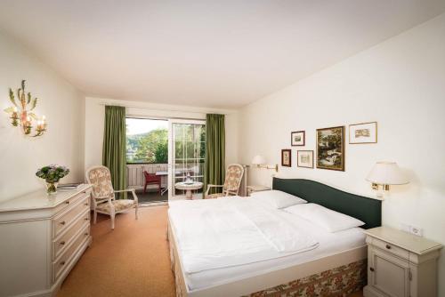 Postel nebo postele na pokoji v ubytování Hotel Villa Rainer