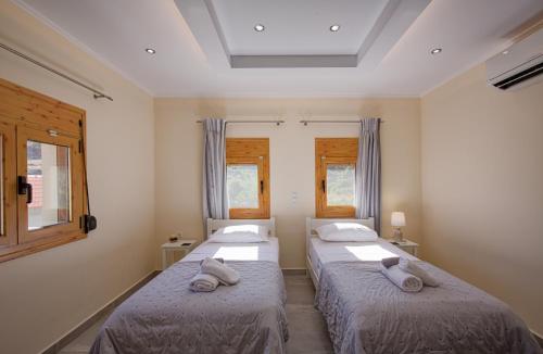 Ένα ή περισσότερα κρεβάτια σε δωμάτιο στο Aspro Apartments