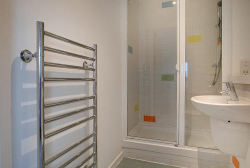 a bathroom with a shower and a sink at All Saints Apartments 5A by Week2Week in Newcastle upon Tyne