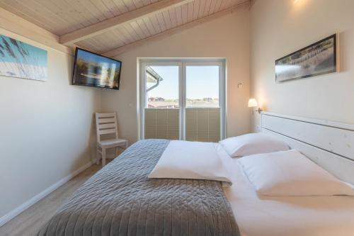 Ένα ή περισσότερα κρεβάτια σε δωμάτιο στο Meeresbrise