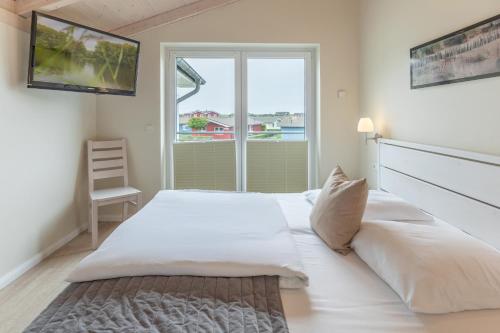 Ένα ή περισσότερα κρεβάτια σε δωμάτιο στο Nordseeluft