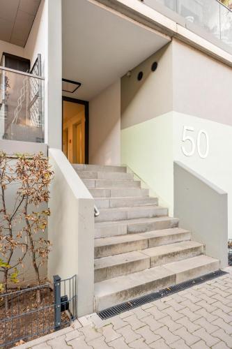 a set of stairs in front of a building at LIVINGLike-Apartment - Central & Spacious with Balkony & Garage, Coffee - 103m2 in Pforzheim