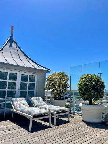 a gazebo sitting on top of a deck at Romney Park Luxury Apartments by The Stay Collection in Cape Town