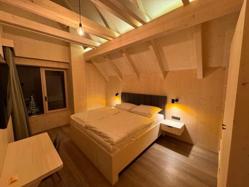 a bedroom with a large bed in a room at Villa Chalet Bledule-wellness & sauna in Roprachtice