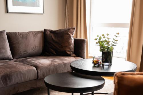 a living room with a couch and a table at Hotel Frøya in Sistranda
