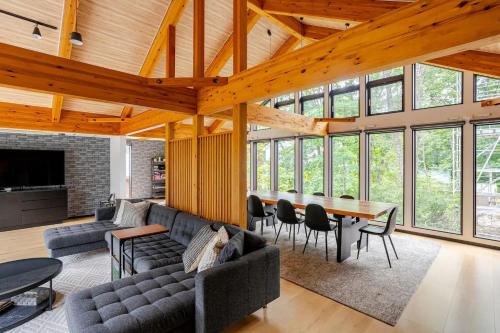 a living room with a couch and a table at Sugoi Chalets in Hakuba