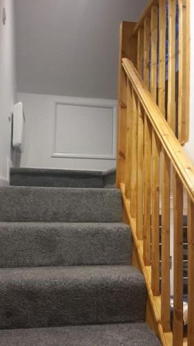 a set of stairs in a room with a stair case at The Retreat in Chelwood Gate
