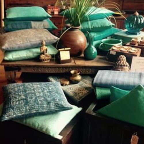 a room filled with pillows and a bunch at The Retreat in Chelwood Gate