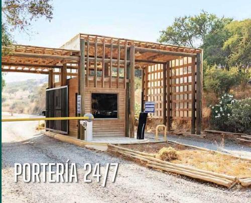 a house being constructed with a wooden structure at Parcela Lago Rapel in Lago Rapel