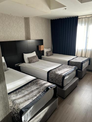Katil atau katil-katil dalam bilik di Grand Denizli Hotel