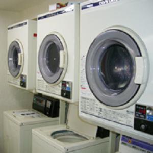 three washing machines on a shelf in a store at Hotel Hashimoto in Sapporo