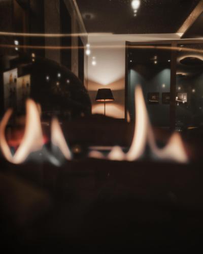 a blurry picture of a living room with a couch and a lamp at Hotel Bad Fallenbach in San Leonardo in Passiria