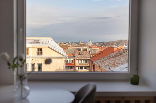 a view of a city from a window at Hook Studios Vilnius Old Town in Vilnius