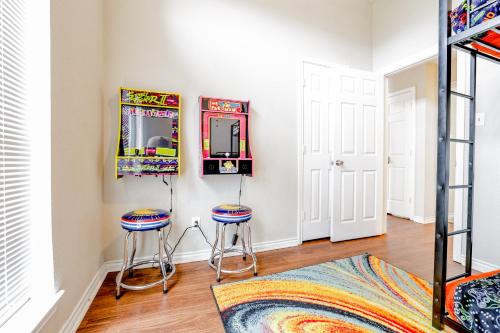 a room with two stools and a mirror at Oasis - Indoor Swimming Pool in The Colony
