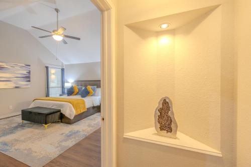 a bedroom with a bed and a room with a window at Oasis - Indoor Swimming Pool in The Colony