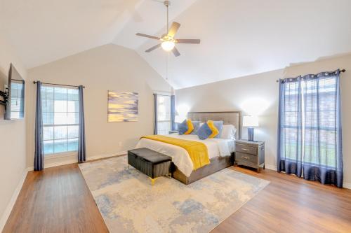 a bedroom with a bed and a ceiling fan at Oasis - Indoor Swimming Pool in The Colony