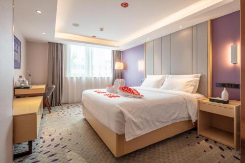 Postel nebo postele na pokoji v ubytování Lavande Hotel Beijing Tiananmen Square Wangfujing Street Branch