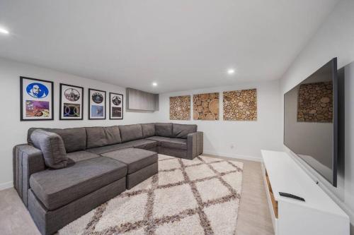 a living room with a couch and a flat screen tv at Wander Malibu Canyon in Malibu Beach