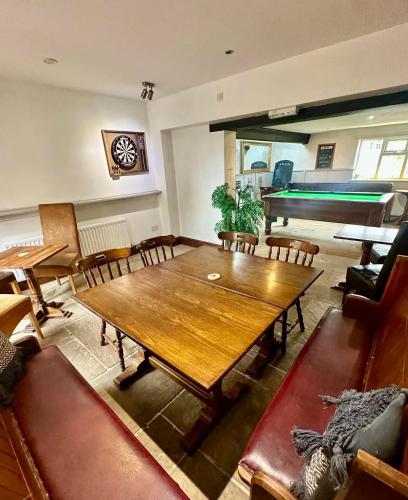 a dining room with a table and a pool table at Courtyard Rooms - Studio - Double Bed - WiFi in Northallerton