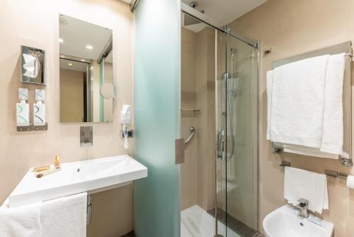 Et badeværelse på Best Western Premier Hotel Royal Santina