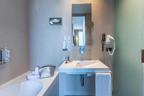 Et badeværelse på Best Western Premier Hotel Royal Santina