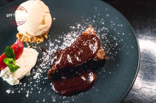 a plate of food with dessert on a table at Great National South Court Hotel in Limerick