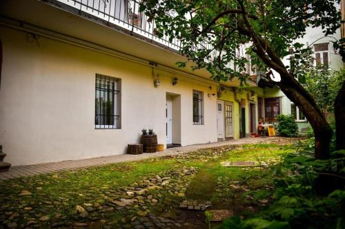an empty alley with a white and yellow building at CLAS Studio in Sibiu