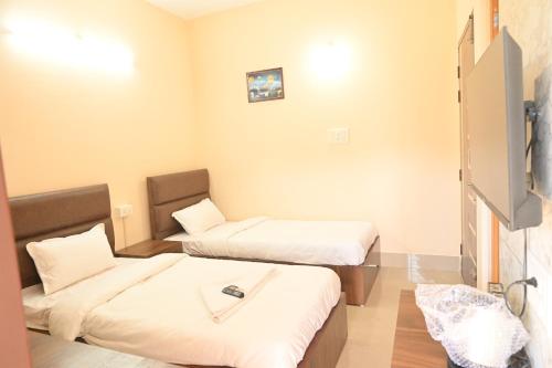 Ένα ή περισσότερα κρεβάτια σε δωμάτιο στο Sunflower Guest House