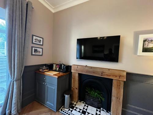 Kuchyň nebo kuchyňský kout v ubytování The Garden Rooms